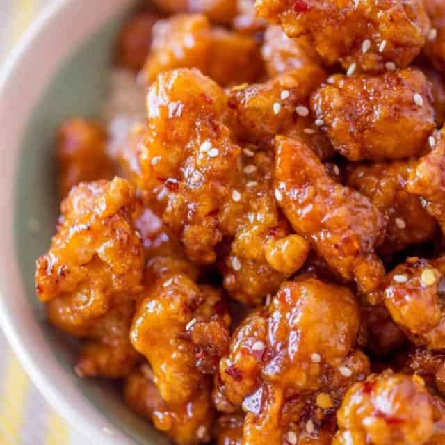 Crispy Korean Fried Chicken in a spicy, sweet glaze that is so crispy and sticky you'll coat everything in this sauce from wings to baked chicken breasts and more!