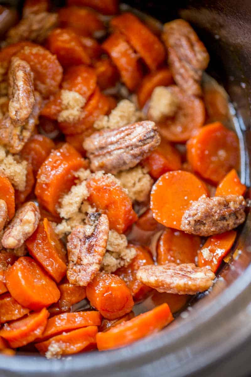 Slow Cooker Brown Sugar Carrots are an easy (and inexpensive) side dish for your holiday meals! Much lower in calories than sweet potatoes with a similar awesome flavor!