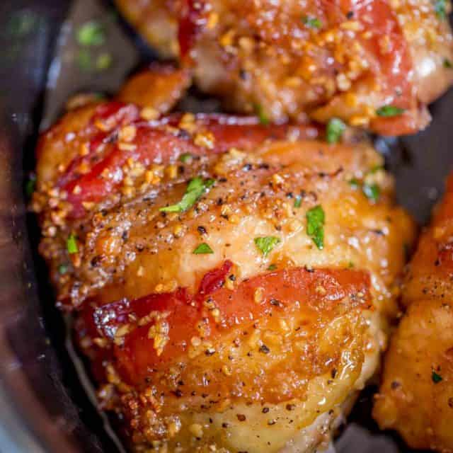 Slow Cooker Bacon Brown Sugar Garlic Chicken is made with just five ingredients in your slow cooker. Sticky, garlicky, sweet fall apart bacon and chicken goodness.