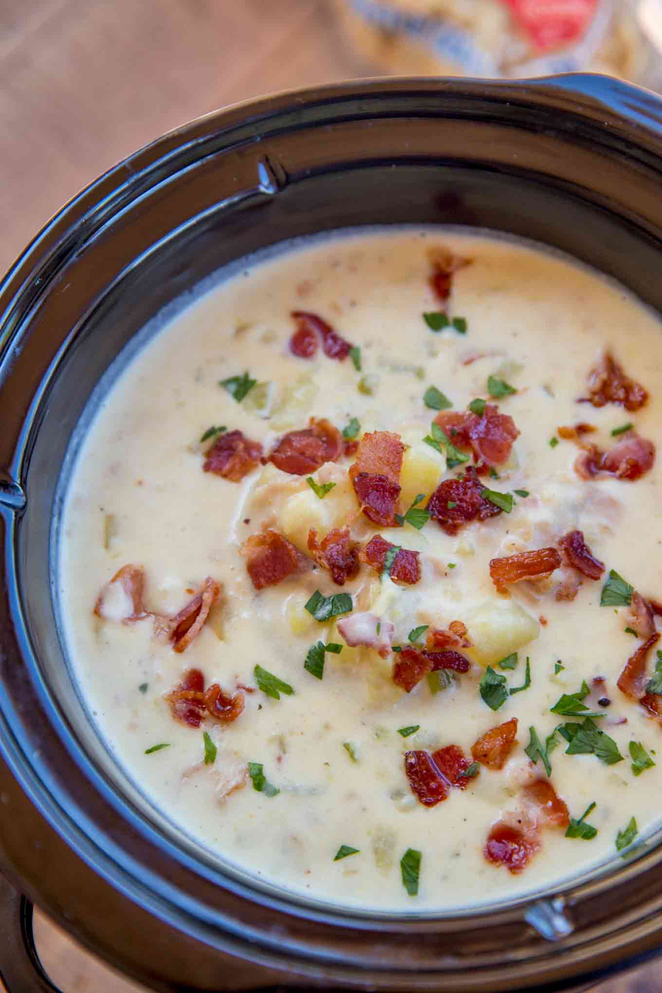 Slow Cooker Clam Chowder is so easy to make with a deliciously creamy, briny flavor mixed with smoky crispy bits of bacon and rich buttery yukon potatoes.