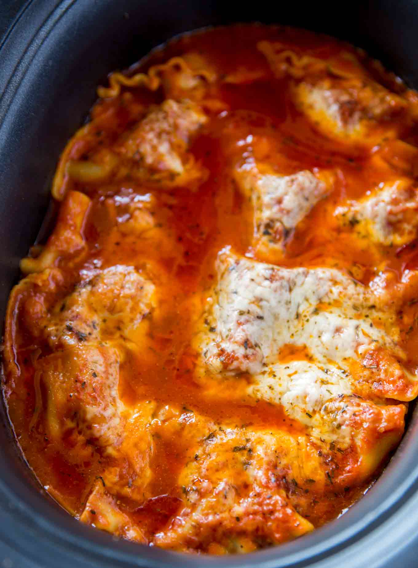 Slow Cooker Lasagna made with lasagna noodles, beef, mozzarella, ricotta and Parmesan cheese is the ultimate comfort food in just 20 minutes of prep time.