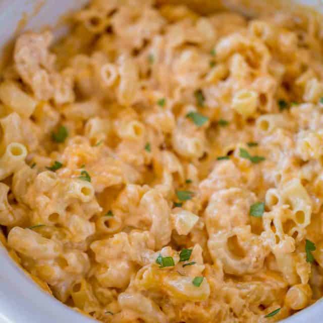 Slow Cooker Mac and Cheese is super creamy and cheesy with no boiling or pre-made noodles and no velveeta or condensed soups!
