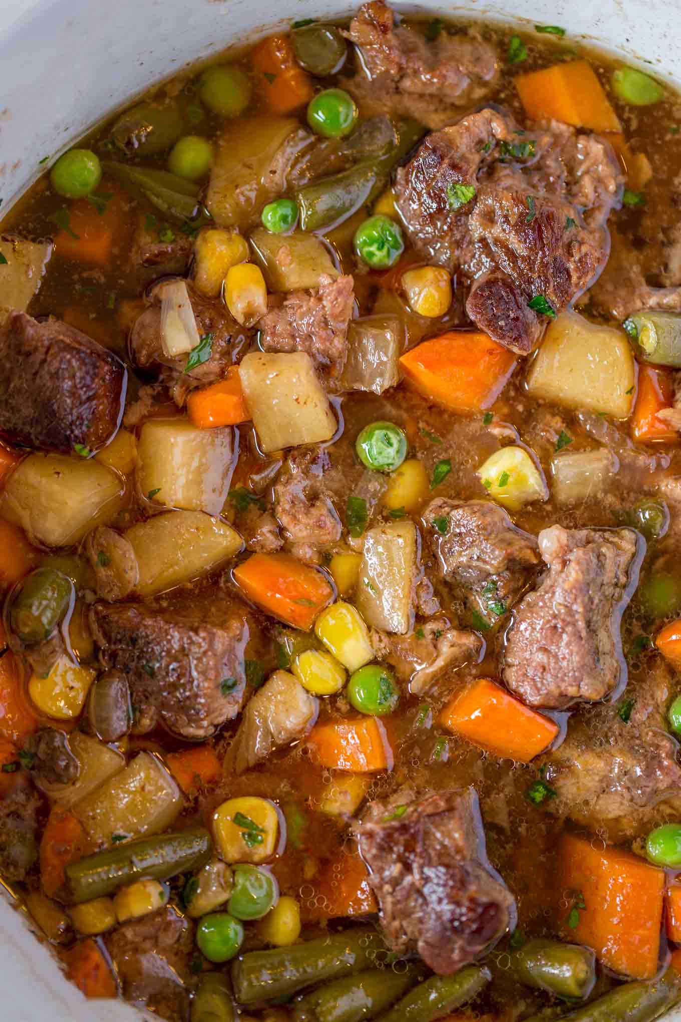 Slow Cooker Vegetable Beef Soup with is the most comforting, EASY soup you'll make. You'll want to dip crusty bread into the amazing flavors in this soup!