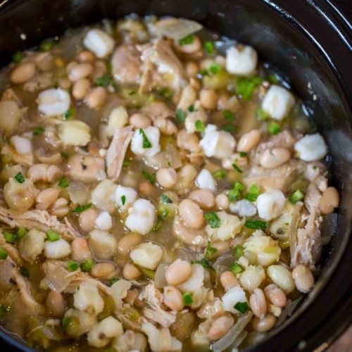 Slow Cooker White Chicken Chili with hominy, white beans, chicken and peppers is the perfect, easy white chicken chili of your dreams.