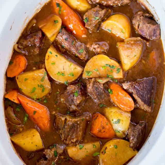 Ultimate Slow Cooker Beef Stew made with chuck roast, Yukon potatoes and carrots for a rich beef stew that is perfect for the cold weather.