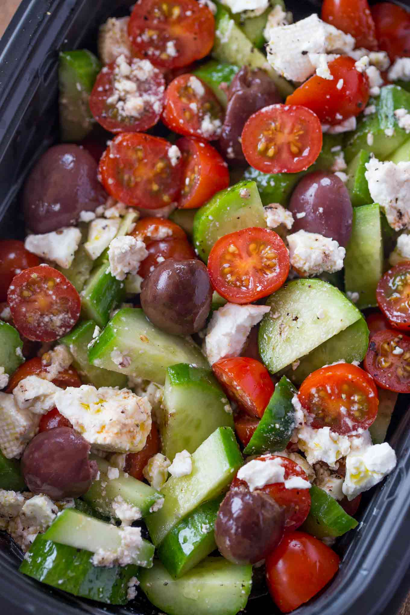 Easy Greek Salad with cucumbers, grape tomatoes, feta cheese and kalamata olives with a lemony red wine vinaigrette dressing in just five minutes.