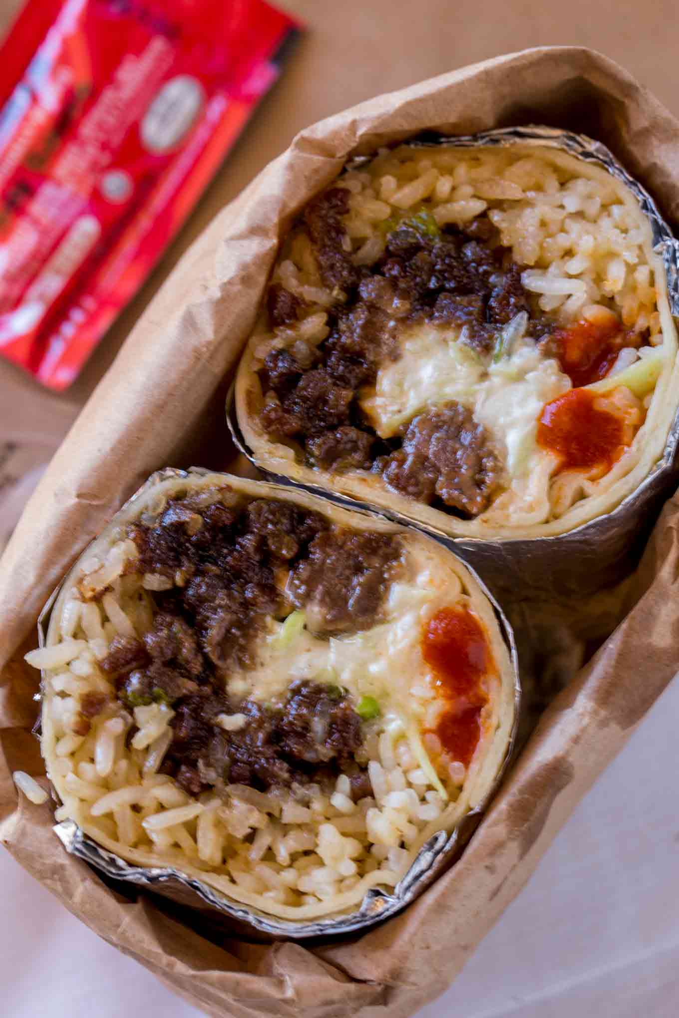 Mongolian Beef Burrito made with ground Mongolian beef, seasoned rice, Sriracha and a quick Asian mayo slaw. It's the best burrito you've had since Kogi bbq came on the scene.