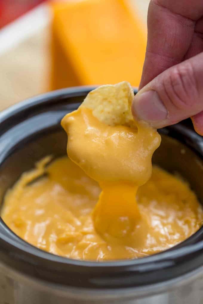 Melted cheesy nacho cheese sauce made in the slow cooker!