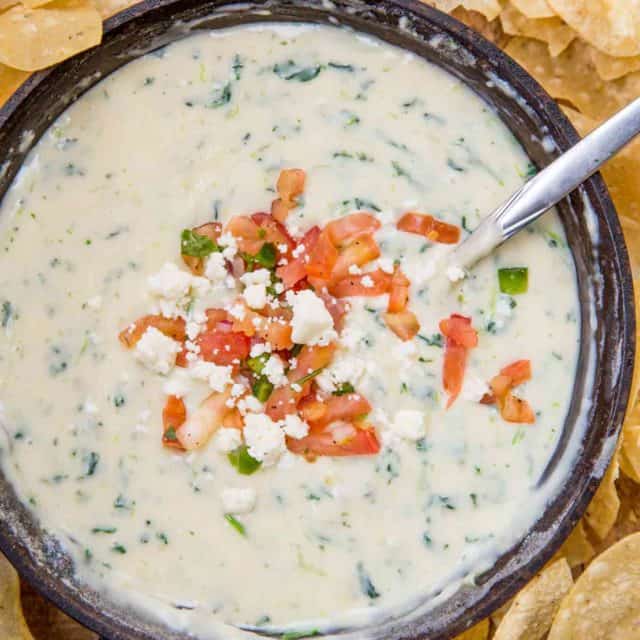 White Spinach Queso in pan with chips