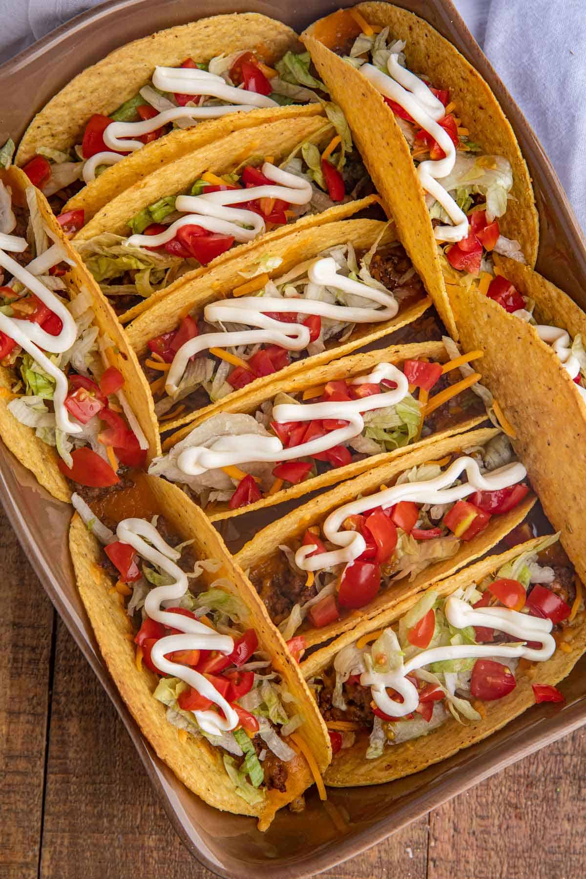 Baked Beef Tacos with toppings in baking dish