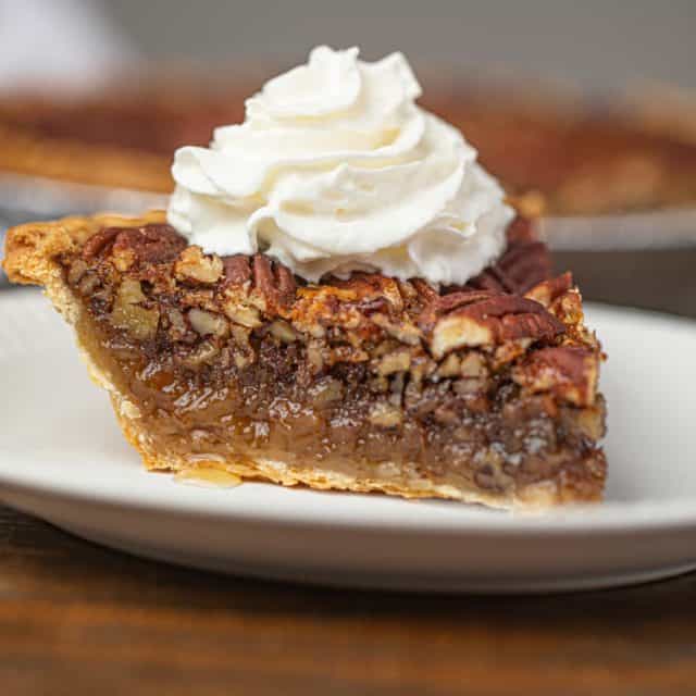 Pecan Pie with Whipped Cream on Plate