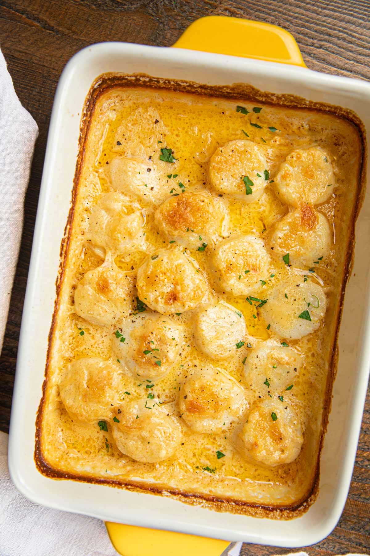 Scallop Gratin in white and yellow baking dish