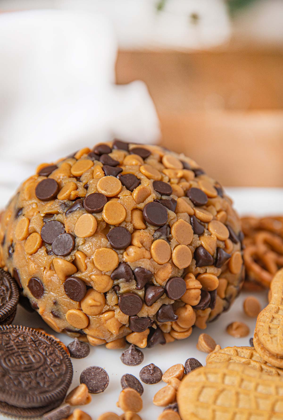 Chocolate Peanut Butter Cheese Ball Dessert on board with crackers and cookies